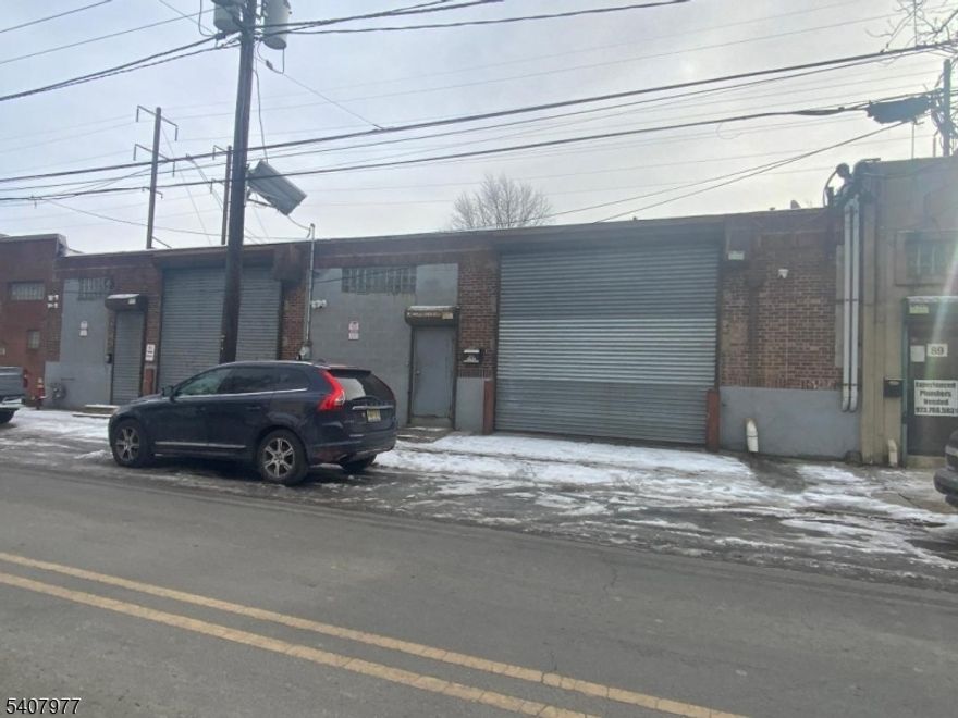 Ironbound section 5619 sq ft warehouse on 1st industrial Zone or light Industrial. with 2 overheads doors currently divided in 2 spaces approximately 2 250 sq ft used by owner and 3,350 sq ft used by a tenant lease expire May 2026. 1 gas meter ,1 electric meter gas heat blower concrete floor. High ceilings.