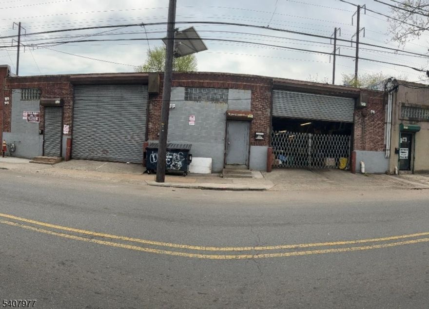 Ironbound section 5619 sq ft warehouse on 1st industrial Zone or light Industrial. with 2 overheads doors currently divided in 2 spaces approximately 2 250 sq ft used by owner and 3,350 sq ft used by a tenant lease expire May 2026. 1 gas meter ,1 electric meter gas heat blower concrete floor. High ceilings.