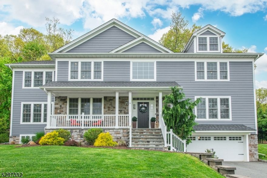 Nestled on a fantastic tree-lined street of highly desirable neighborhood, this home presents a remarkable blend of luxury, comfort, and functionality. The main floor offers ample space for entertaining and living. Two-story Foyer with stunning staircase offers coat closet and a hidden mudroom. Formal LR features cove ceiling with lighting, a Study adorned with French doors and a built-ins is a perfect WFH spot. Formal DR features coffered ceilings, picture moldings and built-in bar.Chef's kitchen features quartz countertops, JennAir appliances, a large island with seating, plus breakfast area. The FR features gas fireplace, large windows and slider to outdoor space and access to the Powder Room. Completing this level is an In-Law Suite with large closet and full bathroom. Upstairs, discover an expansive primary suite featuring two walk-in closets with closet systems and an oversized bathroom with shower and soaking tub.Completing this level is a junior suite with its own walk-in closet and full bath, two additional bedrooms that share a Jack-and-Jill bath with shower and a double sink vanity, and laundry room with workstation.The finished LL boasts two rec rooms, full bath, storage/utility room, mud room and access to the two car garage.Outside, the fully fenced yard features a deck, patio with outdoor kitchen, fireplace, hot tub, and steps leading up to a lush lawn area  a perfect haven for outdoor gatherings and enjoyment.