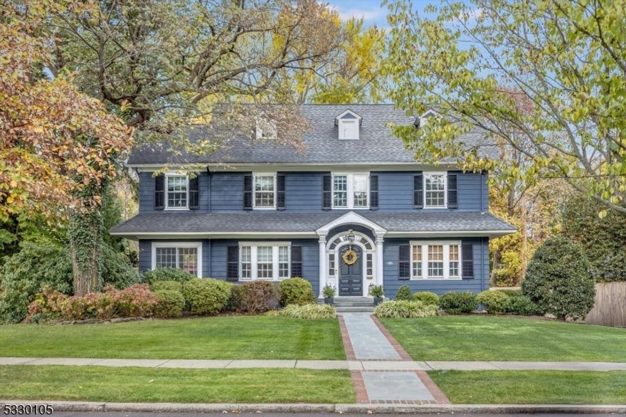 A most gracious and elegant 5 bedroom center hall colonial beautifully appointed with gorgeous original Details and character throughout including high beamed ceilings and mouldings, arched entry and hardwood flooring throughout. A perfect combination of yesterday with all the modern amenities of today. The center hall flow allows for seamless daily living. Entertaining is a dream throughout the 1st floor and leading directly to the stunning backyard and patio complete with built-in grill, spacious prep counter and large built-in gas fire pit. Upstairs the sophisticated primary ensuite bedroom BOAsts a spectacular custom walk-in closet and renovated bathroom. Two additional bedrooms and a full bath round out the 2nd fl all adjacent to exquisite staircase and landing. A spacious 3rd fl awaits with a bedroom/office and an additional bedroom with a separate room perfect for homework or a dressing area plus a 3rd fl hall full bath. Excellent for guests. The fully finished basement (with French drains) is the center of activity and the perfect spot for fun and play! Loaded with built-ins, storage, a large laundry room with mudroom area and a half bath. All this and located in the sought-after north end neighborhood of historic Glen Ridge, it's highly rated NJ school system and the hub for the NYC Midtown direct train. Top that with its close proximity to trending Montclair restaurants, shops and famous farmer's market. Welcome home!