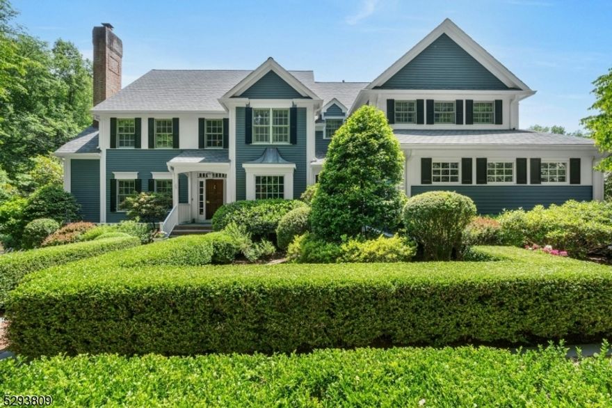 Welcome to Dogwood Meadow, an idyllic, private two-acre retreat nestled in the historic hamlet of Brookside in Mendham Township. Cold Hill Reserve, with 57 acres of preserved land, borders the property & provides incomparable privacy. Main level highlights include an elegant formal living room with wood-burning fireplace, an English pine paneled library, a formal dining room, a gourmet eat-in kitchen with walk-in pantry & breakfast room & a family room with a dry bar & another wood-burning fireplace. Two powder rooms, a laundry/mudroom, the back staircase & entrance to the attached three-car garage complete the first level.  Five bedrooms & three bathrooms can be found on the second level. The primary suite boasts a walk-in closet & luxurious ensuite bathroom. The finished lower level has a large recreation room, powder room, cedar closet, utilities & storage spaces. Exceptional millwork, sophisticated architectural elements & superior finishes are found throughout the home, along with abundant natural light. Outside, a patio & sweeping lawns offer western sunset views & overlook the stunning pool complex. The pool house includes an outdoor kitchen, seating area & powder room. A brick-walled outdoor fireplace with seating area provides a warm, four-season gathering space. This hidden jewel also offers an ideal location: just a three-minute drive to local shopping, convenient access to highways & a mere 13 minutes from Morristown's vibrant downtown & NJ Transit train station.