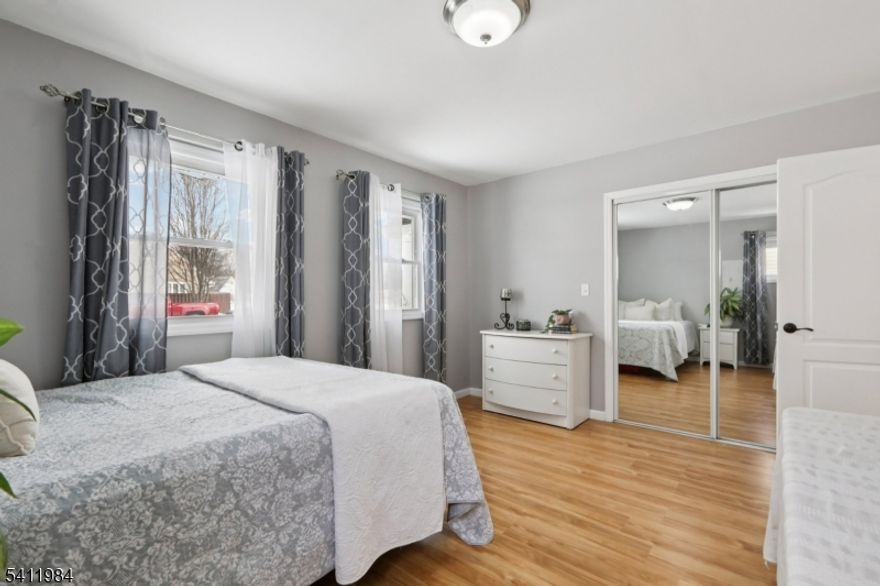 Custom colonial in the heart of Colonia offering a generous, flexible layout. The first floor BOAsts a light-filled living room, large family room with a wood stove, a renovated kitchen brimming with cabinet and counter space, a breakfast bar, eat-in kitchen, separate dining room, and best of all, a bedroom and full bathroom perfect for guests. On the second floor, find a spacious primary bedroom with a seating area, dressing room and an ample walk-in closet, three additional sizable bedrooms, another renovated bathroom, and a reading nook complete with a picture window. Extensive storage throughout, an ample laundry room, oversized garage, paver patio, and fully fenced yard round out this perfect home. Conveniently located near schools, parks, shopping and public transportation.