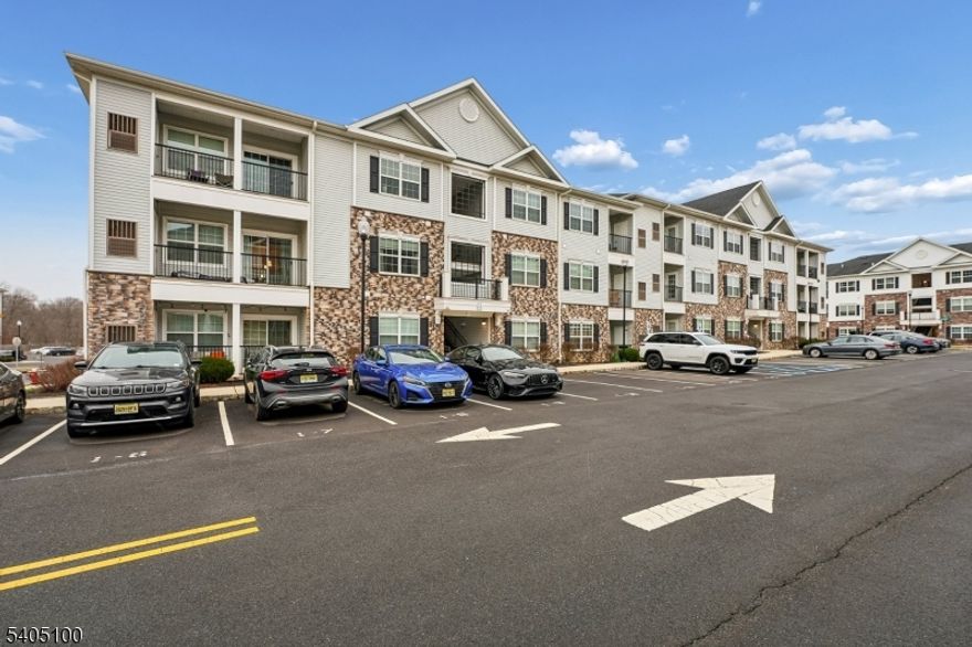 Move-in Ready!  632 Marion Lane is a stunning 2 bedroom, 2 bath, Denali 3rd floor end-unit.  Enjoy this highly sought-after Monroe Parke development home with no residents above you and easy elevator access. The open floor plan is great for everyday living or entertaining. The chef of the house will enjoy the plentiful white cabinets, granite countertops, and stainless-steel appliances. The kitchen overlooks the large dining room and living room with luxury vinyl flooring. Doing laundry is a breeze with the convenient in-unit laundry center.  The two large bedrooms, one with ensuite bathroom and large walk-in closet with organizer offer an abundance of natural light, large closets, and the possibility of using one as a home office.  Enjoy a beverage on your private balcony off the living room. Amenities of the development include a Clubhouse, heated pool, fitness center, and playground.  Conveniently located near commuter Route 33, Route 18 and the New Jersey Turnpike.