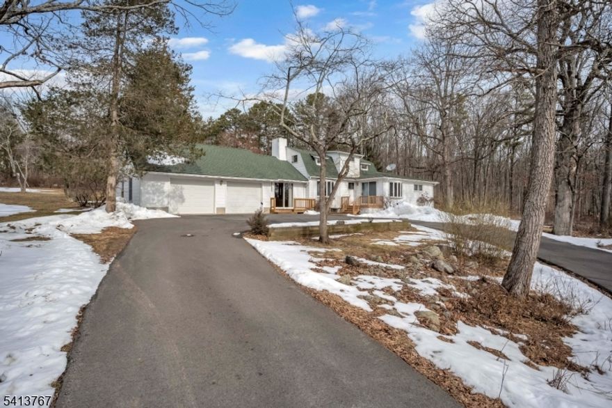 Welcome to this impeccably maintained custom Cape Cod, where pride of ownership is evident at every turn. Perfectly positioned on over five picturesque acres, this property offers mature trees, open level land, & endless potential; all in a private setting just minutes to town & major commuting routes. From the moment you arrive, you'll appreciate the circular driveway & truly oversized 2 car attached garage designed for convenience & everyday living. Inside, the home offers warmth, flexibility, & opportunity. A spacious living room anchored by a classic wood-burning brick fireplace invites cozy gatherings, while hardwood floors flow throughout much of the home. The expansive eat-in kitchen provides generous space for daily living & entertaining. The 1st floor eastern wing features a private bedroom w/ double closets, full bathroom, large formal dining room easily convertible to a family room or secondary living area, & a separate entrance; ideal for a traditional mother-daughter or in-law suite configuration. Upstairs offers two additional well-proportioned bedrooms & a second full bathroom. w/ a newer roof & meticulous upkeep throughout, you can move right in & personalize at your own pace. This is more than a home, it's your next chapter waiting to be written.