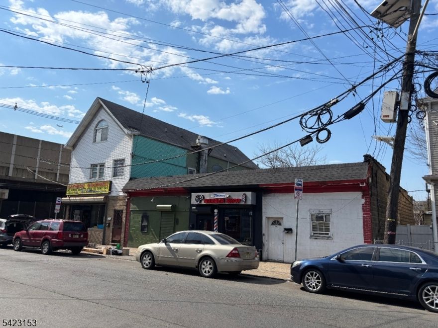 Fully Rented Mixed Use Corner Property.