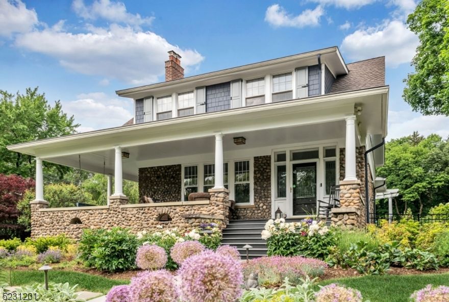 Step into a world where history meets elegance in this breathtaking turn-of-the-century estate. Nestled amidst lush landscaping, this home effortlessly blends the charm of yesteryear with modern amenities. Step inside to discover chestnut finishings, stained glass windows, fireplaces, and stone-work frozen in time. The open layout surrounds a high-quality gourmet kitchen. The sun-drenched master suite boasts an elegant bath, fireplace, and a floor from a 200+ yr old French chateau. Additional features include an in-ground pool,wrap-around porch,3-car garage,newer HVAC systems,roof, and windows. Impeccably maintained, this Craftsman-Style Colonial offers 4 beds,3.5 baths, and custom details throughout. The luxurious master suite showcases a fireplace and overlooks the beautifully landscaped backyard with  heated pool. Built-in 1932, it exudes old-world charm with modern amenities. Schedule a private showing today to immerse yourself in the captivating story of this remarkable home.