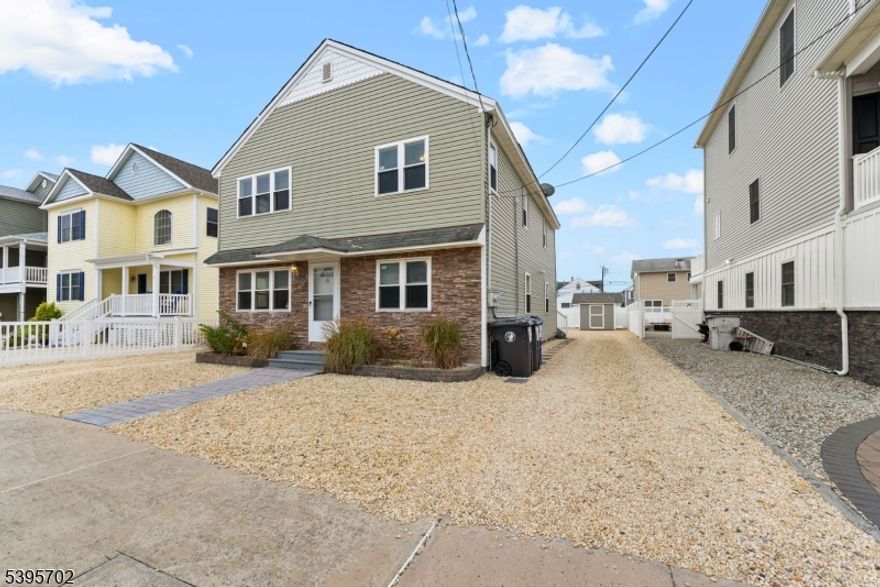 Location, Location, Location! RARE two-family home on beach block, ½ block from the ocean and in a prime location within walking distance to all the local restaurants/shops!  Home is currently used as a seasonal income producing property, but can also be used as a primary residence as well. Each floor possesses 3 bedrooms and 2 baths (1.5 each floor), granite countertops, wood-plank tile floors, real finished oak hardwood floors, and washer/dryer units. The home comes fully furnished, has two large locking storage sheds, an outdoor shower, and 2 new central AC units. In addition, each floor has polywood patio sets with seating for 8 people with retractable/tilting umbrellas, and 2 outdoor propane grills. The upstairs residence has a sliding glass door leading to a large composite deck, and the downstairs residence has a paver patio. There is off-street parking for 8 cars, including driveways on each side of the house (with parking for 4 cars in each one).