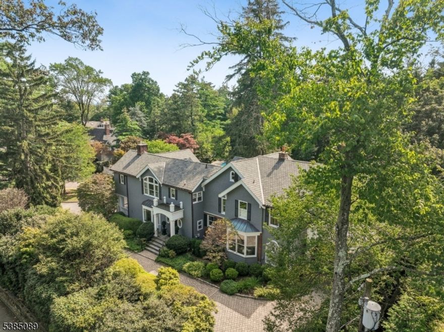 Less than 20 mi from NYC, this impeccably maintained luxury estate, situated on over 2 acres within the prestigious gated community of Llewellyn Park offers unparalleled privacy & sophistication.This property provides a serene retreat with resort-style amenities plus incredible potential for a home studio, car collection or equestrian pursuits. This unique compound includes 4 distinct structures, centered around the bright and airy main residence - with 4 bedrooms, 2 full & 2 half baths & a vaulted kitchen-family room that opens to sweeping views of the salt water pool & surrounding greenery. The main level features a formal living room, dining room, open kitchen and family room, office, powder room, + access to the handy porte cochere. The second level features the primary suite with dressing room & spa-like bath, 3 addtl bedrooms & hall bath.The expansive lower level features a billiards room, sauna, laundry room, half bath & ample storage. The 3 additional climate controlled structures are truly unique. The spacious 4-car tandem garage with loft storage adds practicality & the two-bedroom pool house offers a modest apartment and garden views. The expansive carriage house includes a cobblestone courtyard & an upper-level 2 bedroom legal & rentable apartment.The lower level offers incredible potential for an artist's studio, office, car collection or even a stable.This home's multiple patios, mature landscaping & lush lawn make it perfect for relaxation & entertaining.