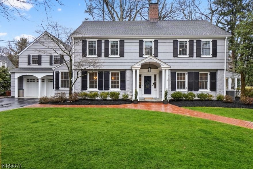 MINT CONDITION 5-BR COLONIAL IN PREMIER OLD SHORT HILLS LOCATION. Classic elegance blends w/modern updates & livability.  Inviting foyer leads to banquet sized DR & LR w/fireplace. Beyond lies the sunroom w/designer tile floor & patio access. Towards the rear, the gourmet kitchen/family room features center island w/bar seating, marble counters, ss appliances, walk-in pantry w/ wine cellar & bkfst area with built-in seating.  The FR is totally open to the kitchen & features refurbished gas fireplace & french doors to patio - truly the heart of the home.  Rounding out the 1st level is a newly renovated mud room/laundry room, powder room with designer wallpaper & 2-car attached garage w/ new garage doors.  Upstairs features 5BR & 3.1BTHS. The primary suite is a zen retreat w/ sitting area, gas FP, multiple closets & spa-like bth w/ steam shower & tub.  The guest suite has a newly renovated full bath. The 5th bedroom easily functions as an upstairs media/homework room.  The third level features a walk-up unfinished attic with so much potential to be transformed into additional living space, while the basement has loads of storage and play space. Step outside to the professionally landscaped flat yard w/ bluestone patio, open lawns and plenty of space for outdoor recreation and relaxation. 15 Chestnut Place is tucked away on a quiet lane and is an easy walk to the Short Hills train station, Glenwood Elementary & downtown Millburn.  Unpack your bags and move right in!