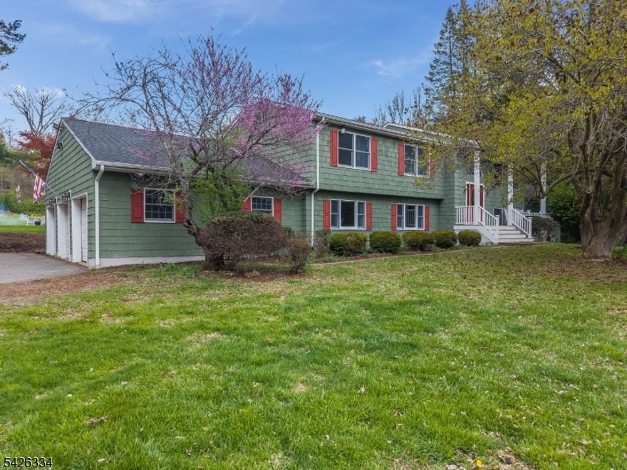 Located in highly sought-after Tewksbury Township with a desirable Lebanon mailing address, this custom bi-level Colonial offers space, versatility, and a prime rural setting. Set on 3 flat, open acres backing to woods, the property provides exceptional privacy. The home features 4 bedrooms and 3.1 baths with approximately 3,476 sq ft (per tax records). The upper level showcases refinished hardwood floors and an open layout, complemented by a lower level recently added great room. The kitchen offers granite countertops, while the basement includes walkout access ideal for flexible living or entertaining. Both upper and lower floors each have a bedroom with an en-suite full bath. Recent upgrades include a new main bath (2023), new en-suite bath (2024), and a new roof and gutters (2025), offering peace of mind for the next owner. Additional features include two furnaces, propane heating, well water, cedar shake siding, and gutter guards. Car enthusiasts and hobbyists will appreciate the 3-car garage, two electric car ports, and a large pole barn with two bays. Located in a sought-after rural setting with convenient access to major routes, this property combines modern updates, functionality, and lifestyle appeal in one of Hunterdon County's most desirable areas. Home Warranty included.