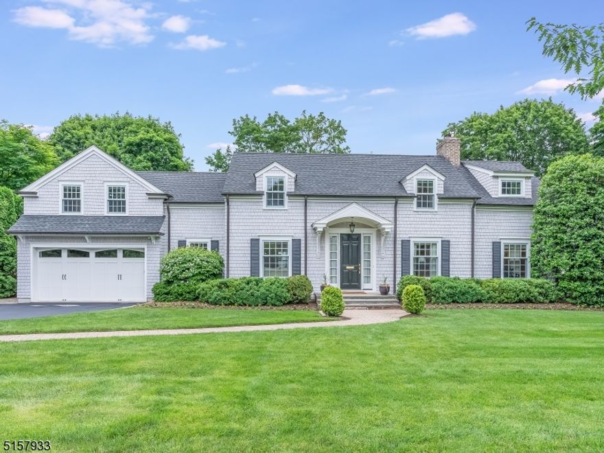 Beautifully updated, this classic four bedroom, three full and two half bath Colonial is located on one of the most desirable streets in Madison's prestigious Hill Section. Impressively renovated in 2015, it was expanded into a gracious retreat with an open concept, flexible floor plan enhanced by fine details such as custom molding, hardwood floors, and upscale finishes. The open concept family room and kitchen features professional-grade appliances, custom cabinetry, an oversized center island, wet bar with hammered nickel sink, and dining area with French doors to the deck. The formal living room features a wood-burning fireplace and access to a separate den/home office through French doors. Completing the first floor are an updated mudroom, two powder rooms and access to the oversized garage. The lower level rec room offers additional gathering space. Upstairs the spacious primary suite features a roomy walk-in closet with built-ins and a spa-like bath. Three additional bedrooms with custom closets, two updated baths and laundry room complete the second level. The professionally landscaped property includes a sunny backyard with rich green lawns and mature trees for shade and privacy. The oversized composite deck is the perfect spot for festive entertaining with a covered sitting area to enjoy the outdoors no matter the weather. Wonderful neighborhood living just moments from Midtown Direct trains, top-rated schools, restaurants, shops and all that Madison has to offer.