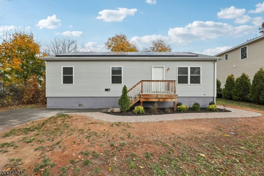 Welcome to this stunning, newly built home completed in 2023! No expense was spared this property features a brand-new roof, brand-new HVAC system, brand-new hot water heater, brand-new windows and modern finishes throughout the entire home, all from 2023. This is truly a turnkey property where everything is NEW.Step outside to your beautifully landscaped yard, offering wonderful privacy and a relaxing atmosphere. Solar panels which will save you money every month!! Enjoy evenings around your custom fire pit, perfect for entertaining or unwinding after a long day.This home is ideally located within walking distance to Manville's popular restaurants and local amenities. You'll love the convenience Somerville is only 5"10 minutes away, New Brunswick just 20 minutes, and New York City only about an hour, making this the perfect blend of comfort and accessibility.Don't miss your chance to own this exceptional, move-in-ready home packed with brand-new upgrades!