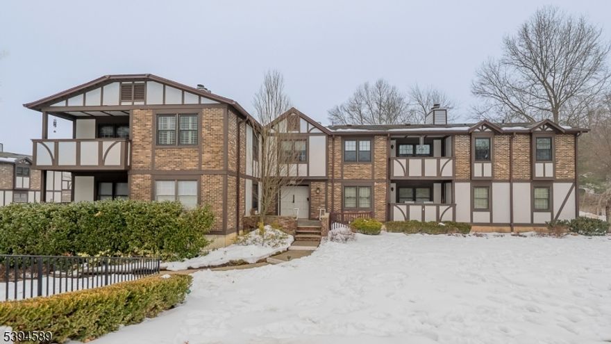 Beautifully updated throughout, this first level 2 Bedroom, 2 Bath Condo in the desirable Heritage Greene complex offers the best in one floor living. Blending thoughtful improvements with functional design, this 1st floor unit is flooded with natural light and style. Freshly painted throughout and boasting brand-new hardwood floors, this condo is move-in-ready! The eat-in Kitchen showcases custom shaker cabinetry, premium appliances, quartz countertops, subway tile backsplash and a pass-through opening to the Dining Room for seamless entertaining. Dining Room with access to private Balcony extends your living space outdoors. The Living Room features a wood-burning Fireplace with granite hearth and built-in shelving, supplemented by a sun-drenched Den/Office featuring a full wall of custom bookcases. Spacious Primary Suite offers two walk-in closets and a refined bath with quartz counters, marble flooring, and walk-in marble-tiled shower. Second Bedroom includes two double closets. Updated full hall Bath with quartz countertop. Laundry closet, one-car Garage, and dedicated private storage room located just one level below complete this well-rounded offering.