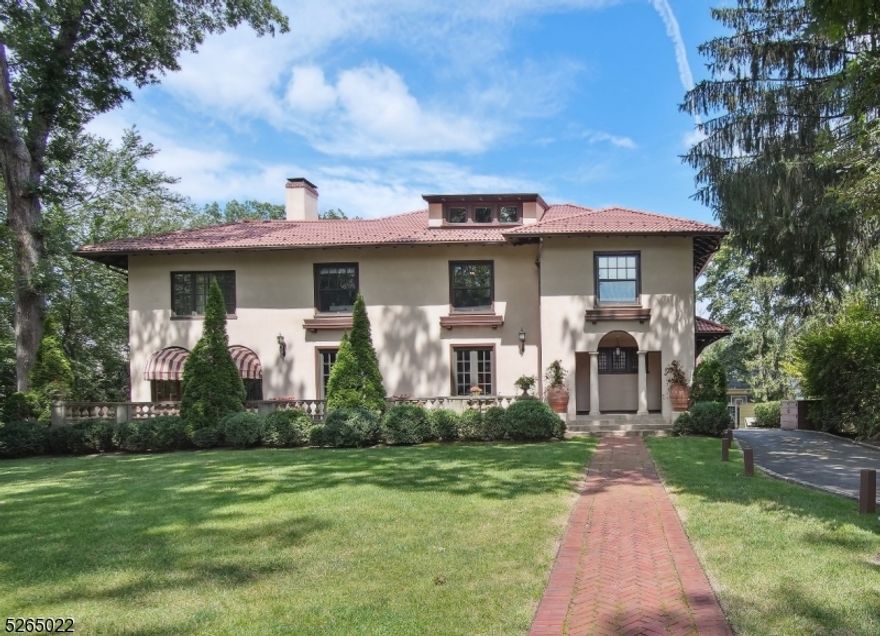 Majestic Mediterranean Masterpiece that has been totally rebuilt and updated for modern living, creating a unique and luxurious living space. You will fall in love with every inch of this gorgeous home. The 1st floor exudes grandeur with impressive oversized rooms and high ceilings. From the grand entrance foyer and huge staircase to the beautiful family room that spans the width of the house with doors that open onto both the front and rear terraces, to the absolutely stunning Euro modern kitchen with a high-top dining island that opens to the impressive dining room with a wall of windows and gorgeous 16th-century hand-painted ceiling. The 2nd floor does not disappoint and features a primary suite with enormous spa-like bathroom. 3 additional bedrooms with large closets, full bath, and laundry complete this space. The 3rd floor provides a lot of flexibility and has a full bath, 2 additional bedrooms and tons office/storage space. The lower level is equally as impressive as the rest of the house with a massive rec room with wet bar, Wine room, workshop, a full bath, and a sunken exercise room. The enormous multilevel blue stone rear patio is an idyllic setting for alfresco dining or relaxation. It overlooks the expansive backyard and features a custom outdoor kitchen w wood burning pizza oven and grill, dining area, fire pit, and whirlpool spa. The property also features a charming 3-car carriage house, complete with a 2nd-story apartment and full bath. This home has it all