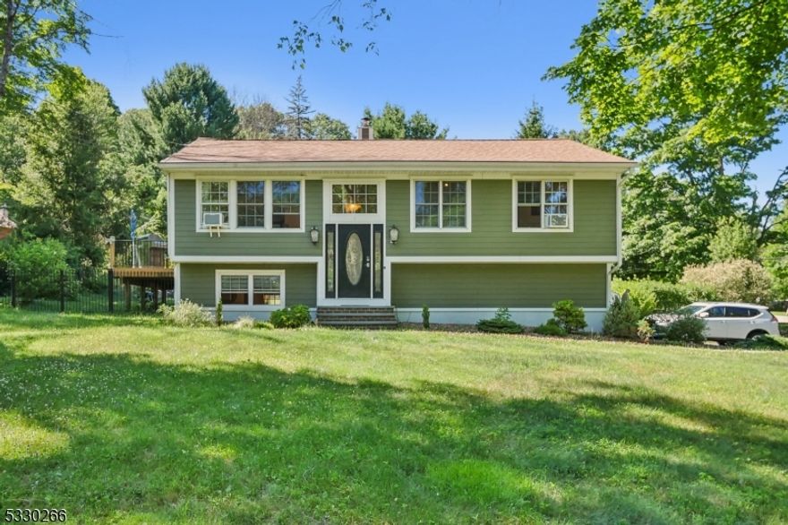 Welcome to your stunning at-home oasis! Enjoy the beauty and functionality of this mother/daughter with renovated kitchens, bathrooms and top-of-the-line finishes. The walk-out ground floor features a large family room and a master/in-law suite with a full kitchen. While the open layout of the 1st floor seamlessly connects the kitchen, living, and dining areas creating an inviting and spacious atmosphere. The formal dining room boasts a vaulted ceiling and abundant natural light, perfect for hosting and special occasions. And, the 1st floor kitchen is a chef's delight, featuring stainless steel appliances, granite countertops, a premium tile backsplash, custom wood cabinets, and a stove pot filler. The ground-floor kitchen is equally impressive with stainless steel appliances, outdoor access, and conveniently located for the master/in-law suite. The ground-floor master/in-law suite includes an ensuite bathroom, walk-in closets, a private entrance, direct patio access, and a ground-floor kitchen. Two oversized first-floor bedrooms provide ample space and comfort for guests. Finally, step outside to your personal oasis! A heated in-ground pool, massive rear deck, and an expansive covered patio offer endless options for outdoor entertaining and relaxation. Conveniently located minutes from Rt. 206 & Rt. 80 and close to numerous local and state parks, including Lake Hopatcong. Don't miss the opportunity to turn this stunning oasis into your dream home!