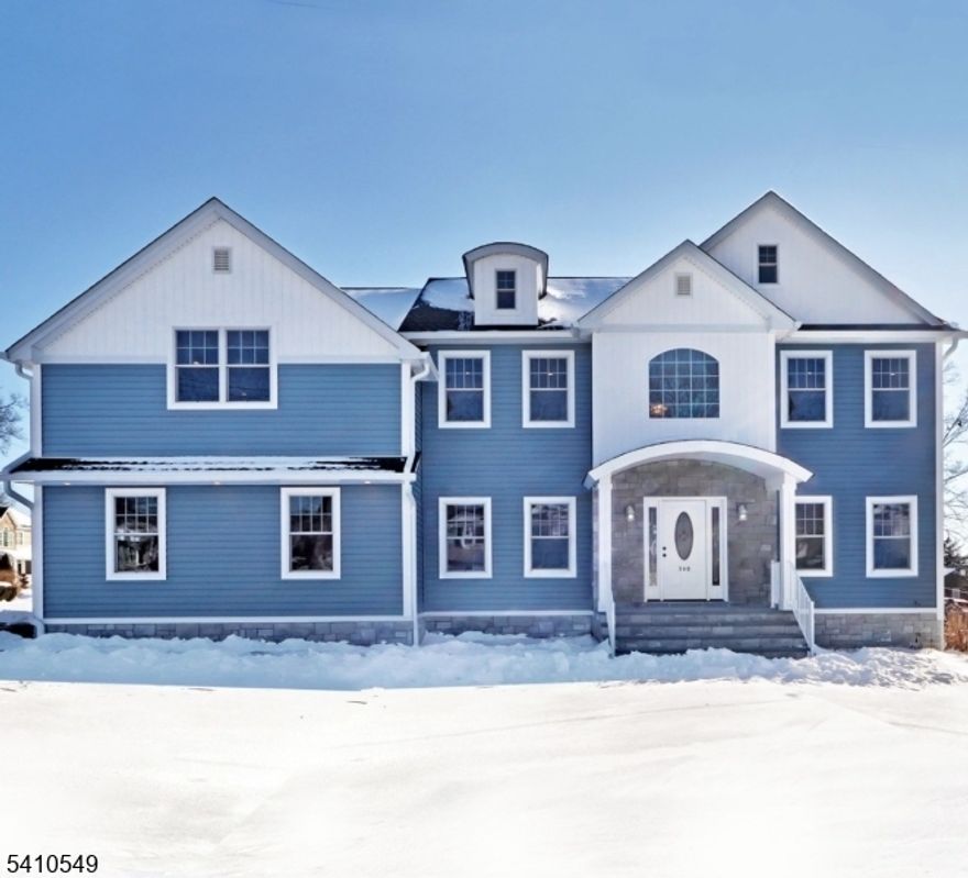 Welcome to your dream home, beautiful new construction right in the heart of Lake Parsippany, built by a highly regarded local builder known for quality craftsmanship. From the moment you arrive, you'll love the curb appeal, complete with a charming paver walkway leading from the driveway to the front door. Step inside to a bright two-story foyer and gorgeous hardwood floors that flow throughout the home. The white shaker-style kitchen cabinets with quartz countertops open seamlessly to a spacious family room featuring a cozy gas fireplace and sliders to a Trex deck, perfect for effortless indoor-outdoor living. Hosting a dinner party? The dining room shines with a coffered ceiling and high-end moldings.  A first-floor bedroom provides flexibility and is ideal as a potential in-law suite, while the formal living room offers additional versatility as a home office or gathering space. Upstairs, you'll find four generously sized bedrooms, including a dreamy primary suite featuring one huge walk-in closet with custom built-in shelving plus two additional closets for exceptional storage, along with a spa-like bath. The finished basement offers even more space to relax, entertain, or host guests, complete with a full bathroom. Thoughtfully designed and filled with natural light, this home blends style, comfort, and convenience in every detail. Conveniently located with access to top-rated schools, major highways, and everyday amenities. This is everything you've been waiting for!