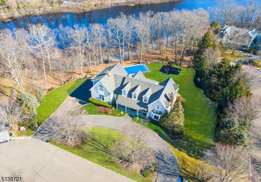 Tranquil water views, glorious sunrises, and crimson sunsets await along Baker Pond in this very special home sweet home. A picturesque cul-de-sac setting, this charming estate has been completely renovated over the last 4 years along with a brand new gunite in-ground pool overlooking the pond that's currently been installed! This lovely home features 5 bedrooms, 5.5 baths, 3 car garage, 1.03-acre property, & a finished walk-out basement w/ full bath. Designer kitchen featuring Wolf appliances/sub-zero/marble countertops/center island/sun-drenched breakfast nook. Exquisite master bedroom/his and her WIC and gorgeous modern master bath w/ radiant floors. Attentive architectural design with a wall of windows across the rear of the home to take advantage of nature's everyday beauty/three different outdoor landings as well to soak it all in! Now is your chance to reserve memorable sunset views for a lifetime as opportunities like this do not come around very often!