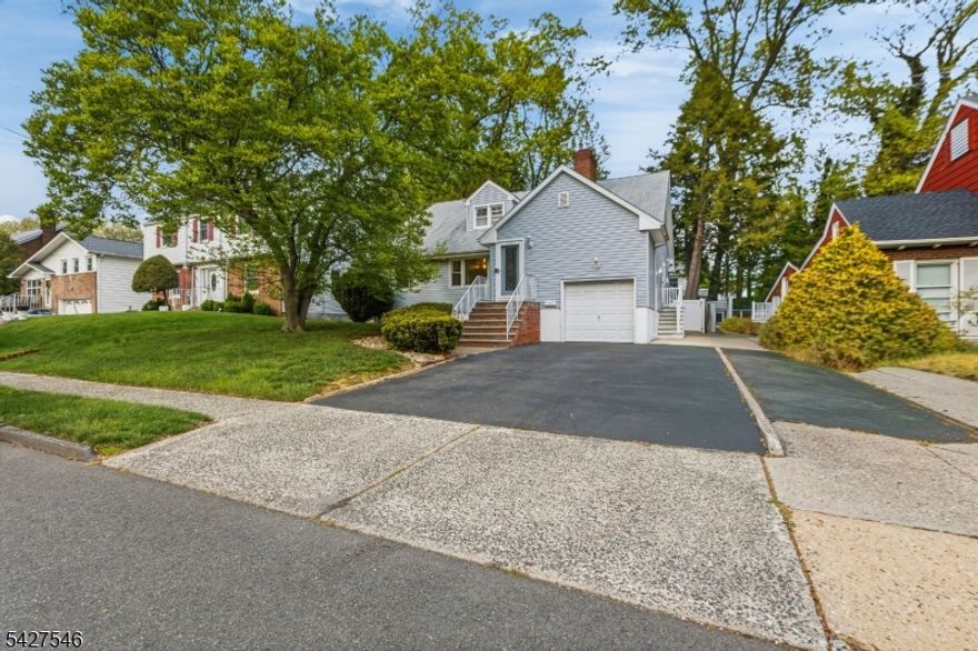 Welcome to this well-maintained 3 bedroom,  2 bath expanded Cape on a quiet, tree-lined street in the desirable Westminster neighborhood. This home offers the perfect blend of classic charm and functional living, ideal for both everyday comfort and entertaining.  Step inside to find a spacious and versatile layout featuring three generously sized bedrooms, with two conveniently located on the first floor. The private primary suite provides a peaceful retreat, complete with its own en-suite bathroom and a walk-in closet. The eat-in kitchen, includes custom cabinetry, granite countertops and stainless steel appliances. Hardwood floors run throughout the first level, and the inviting living room features a cozy fireplace. A newly renovated bathroom adds modern appeal, while the finished basement provides additional living or recreation space.  A den leads to an oversized deck overlooking a beautifully manicured, fully fenced backyard, perfect for entertaining or relaxing outdoors.  Conveniently located between two NYC bound train stations and just a 30 minute drive to the city, this home is also close to shopping, dining, Kean University and Newark Airport . Don't miss this rare opportunity to own a move in ready home in one of Elizabeth's most desirable neighborhoods.