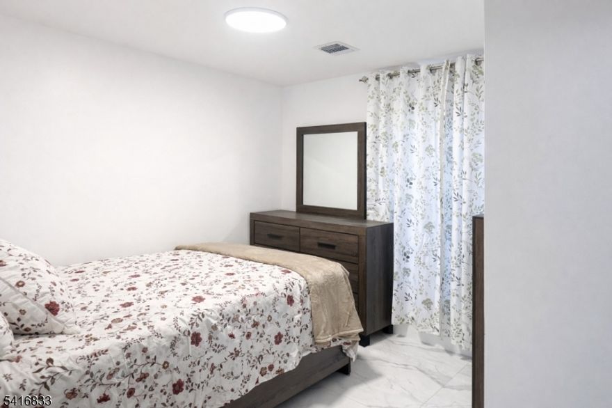 Brand New 2 bedroom 1 bath apartment on ground level on newer construction milti family home. Space includes, open concept kitchen dining area featuring brand stainless appliances, huge livingroom that can fit sectional couch, 2 spacious bedrooms with ample closet space.