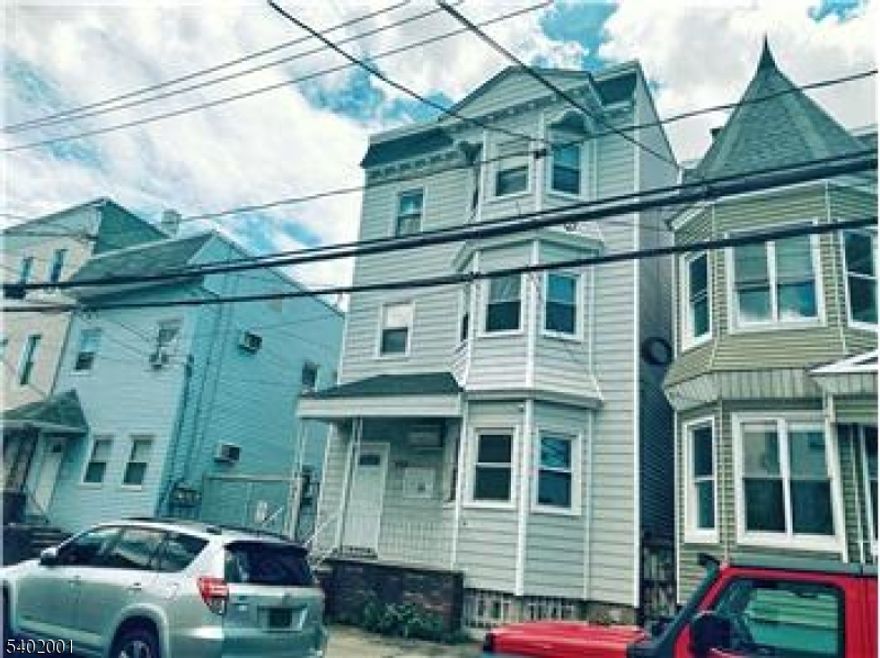 Beautiful, well-maintained legal 3-family property located in one of Newark?s most desirable areas. This unique, recently renovated home features three identically designed units, each offering two spacious bedrooms, a comfortable living room, an eat-in kitchen, and a full bathroom.The property also includes a full basement, offering potential for additional use or customization (buyer to perform due diligence; subject to all municipal approvals).Ideally situated near major institutions and transportation, this property is approximately 0.6 miles from University Hospital, 1 mile from Rutgers Medical School, 0.3 miles from NJIT, 1.4 miles from Prudential Center, 1.6 miles from Newark Penn Station, and just 10 miles from New York City.Whether you?re seeking an investment opportunity, owner-occupant potential, or convenient access to key destinations, this property offers location, versatility, and long-term value.