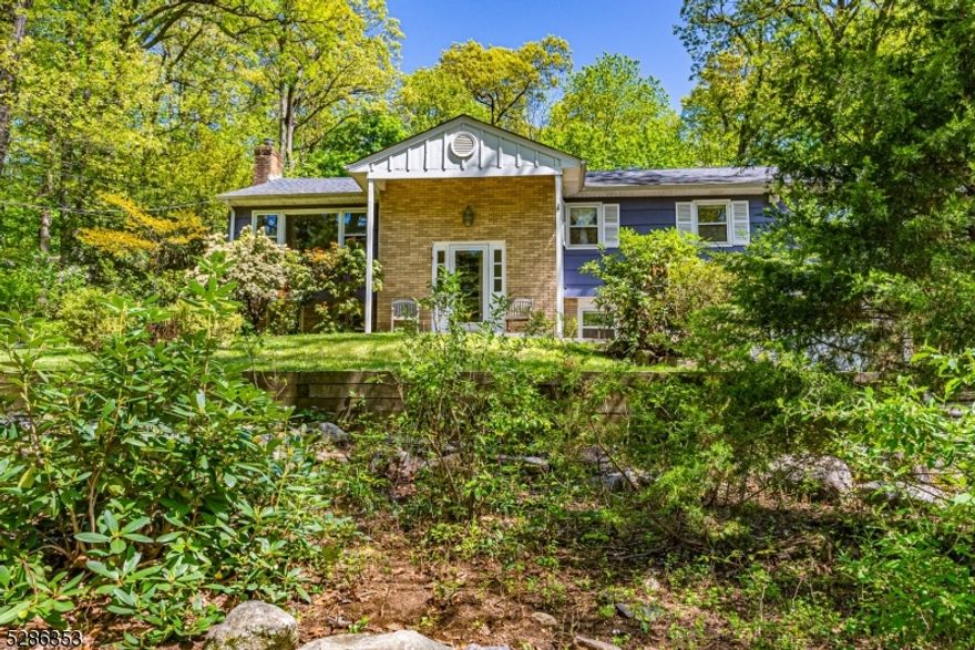 Immaculate Bi-Level! Located on wooded street in Great Neighborhood. Shows pride of ownership. Lots of Generous Room Sizes to Spread Out & Make Your Own! Beautiful HW Floors throughout. BRIGHT living space; HUGE living and dining room Combo. Country Kitchen offers ton of Counter Space. Stunning sunroom with cedar shiplap. 3 BDRM & 2 full baths upstairs include a generous sized primary suite. Family room & 4th BDRM/office on lower level. Half Bath with laundry. Wood burning fireplace w/insert. Plenty of storage space in the attic & 2 Car garage. Backyard is wooded and private. Perfect spot to enjoy nature, mature trees/perennials, lawn, landscape & garden- relaxing! All located in the welcoming Rock Ridge Lake community. Short proximity to Downtown, parks & TOP schools. . Mins to NYC Direct train/bus & EZ access to Hwys.