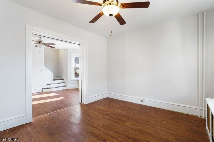 Welcome home to this spacious, solid brick end-unit townhouse that is freshly painted inside and offers 3 bedrooms and 1 full bath and also includes a 1 year free HOME WARRANTY! The main level features a kitchen, formal dining room, and living room accented by beautiful pocket doors and classic moldings. Additional highlights include thermal windows, a NEW refrigerator, ceiling fans, carpeting and hardwood flooring in upstairs bedrooms and hallway, two outdoor spaces with both a rocking-chair front porch and a separate side porch, and a detached 2 CAR GARAGE W/OFF STREET PARKING for up to 4 vehicles. The partially finished walls in full basement provide excellent potential for additional living space and comes equipped with laundry hook up. As a rare end unit, this home also boasts a private side yard which is perfect for pets, gardening, or outdoor entertaining. Even better, there are NO Association Fees, giving you the freedom to make it your own. The included 1 YEAR HOME WARRANTY covers plumbing, electrical, appliances, and heating (see policy for details). All mechanical systems are in good working order; however, the home is being sold as-is. An excellent opportunity for first-time buyers or investors looking to add value with minor updates. Conveniently located minutes from commuter routes, shopping, attractions, and downtown Easton.