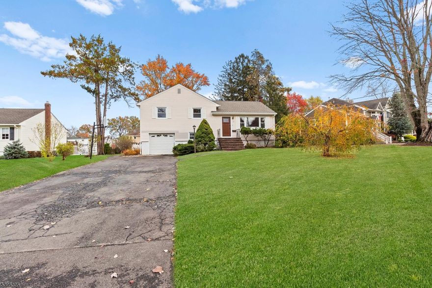 Welcome to this beautifully maintained split-level home, perfectly situated on one of the most picturesque streets in the heart of East Hanover. Brimming with warmth and charm, this residence offers the perfect blend of style and functionality across four thoughtfully designed levels.  Highlights include a brand-new roof, an updated kitchen with newer SS appliances, a renovated bathroom, freshly painted interiors, gleaming hardwood(& laminated) floors, and recessed lighting throughout.  The four levels of living space provide a flexible layout for modern living.  The basement serves as a versatile office or playroom, while the finished ground level with a full bathroom functions beautifully as a family room or entertainment room.  Step outside to a spacious deck overlooking a large, level backyard  a true sanctuary ideal for weekend gatherings or quiet moments of relaxation, surrounded by lush landscaping.  Enjoy an exceptionally convenient location within a top-rated school district, close to transportation and vibrant downtown shops.  All room and floor plan dimensions are approximate.