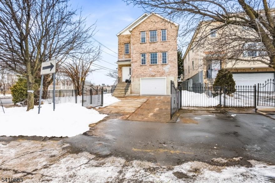 Welcome to 215 Hillside Ave, a beautifully renovated new construction 3-family brick home offering spacious layouts, modern updates, and outstanding income potential in Newark. This impressive property features three well-designed units, including a first unit with two bedrooms and two full bathroos, and two additional units each offering four bedrooms and two full bathrooms, providing a total of 10 bedrooms and 6 full bathrooms. The second and third units include separate dining areas, bright living rooms, and functional kitchen layouts, while the solid brick exterior adds durability and curb appeal. Situated on a generous sized lot with a built-in two-car garage and additional driveway parking, this property delivers both convenience and strong rental appeal. With its versatile layout and move-in-ready condition, this is an exceptional opportunity for homeowners and investors alike. Grab it before it's gone.