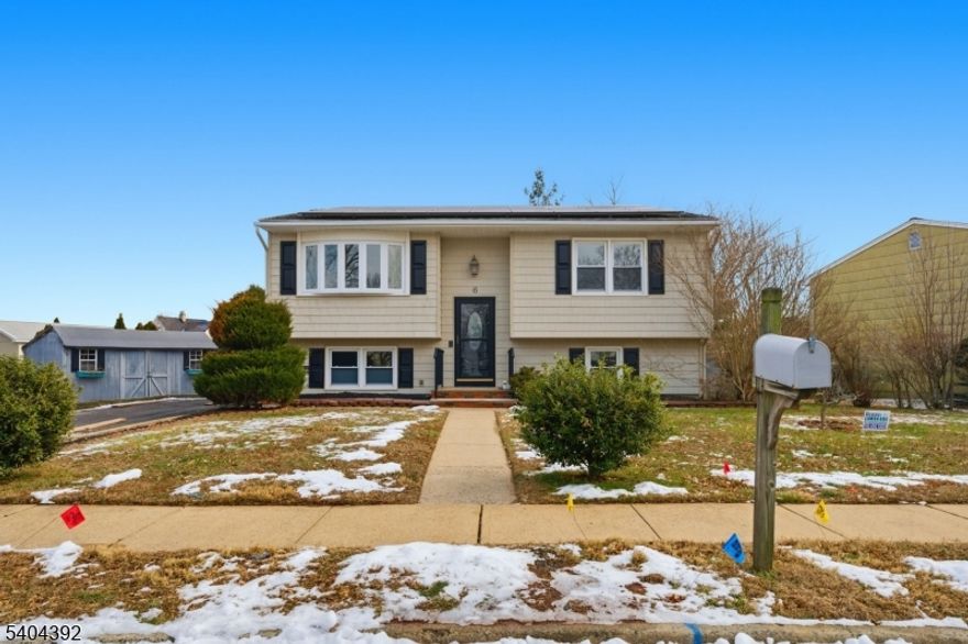 Completely remodeled from top to bottom, this exceptional 5-bedroom, 2-full-bath home offers modern finishes, flexible living space, and a layout ideal for today's lifestyle, all in a great part of Middlesex. Beautiful hardwood floors flow throughout the home, creating a warm and cohesive feel from the moment you enter. The stunning new kitchen is the heart of the home, featuring quartz countertops, stainless steel appliances, a wine fridge, and ample cabinetry. Sliding glass doors lead to a brand-new Trex deck, making indoor-outdoor entertaining effortless. The main living level is filled with natural light and features a spacious family room and dining room combination with large windows and an open, inviting layout. Upstairs, you'll also find three generously sized bedrooms and a beautifully finished, brand-new full bathroom with modern design and finishes. The lower level expands the living space with two additional bedrooms, another brand-new full bathroom, and a huge living room or flex space that works perfectly as a media room, home office, gym, or guest area. All with high end laminate flooring. Additional highlights include updated systems, leased solar panels for low energy billls, thoughtful renovations throughout, and nothing left to do but move in and enjoy. This home offers space, style, and versatility in a sought-after Middlesex location close to everything.