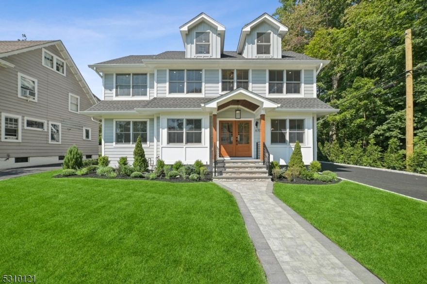 Simply Stunning! Expanded and flawlessly renovated, this exquisitely crafted home has it all! Located on a cul-de-sac in a premier Montclair location with beautiful Brookdale Park at your doorstep. Designer touches throughout with high-end fixtures, woodwork, craftsman molding, and a fabulous open floor plan. Chef's kitchen with custom cabinetry, waterfall center island, quartz countertops, Viking appliances, butler's Pantry, sundrenched family room with picture windows and a gorgeous gas fireplace overlooking expansive yard, two-story foyer, dining room, office/den, mud room & powder room completes the first level. 2nd level offers a Primary Suite with tray ceiling, walk in closets, spa-like Bath with radiant heat floors and a balcony overlooking the backyard creates a private retreat. 3 other incredible bedrooms on 2nd level (1 is ensuite) with fabulous custom closets & laundry room. A 3-story addition enhances the home with another ensuite, and a private office is a bonus. Finished lower level is perfect for gym, media, rec room and a wine room. Outside does not disappoint with Flat, Sprawling lush yard, brand new patio, arborvitae trees all around & full irrigation system creating a backyard oasis. Additionally, 2 car detached Garage with custom doors. Close to Watchung Plaza, Restaurants, Midtown Direct Train, GRCC and all Brookdale Park has to offer, where you can enjoy pickleball, tennis, playground, strolls & summer concerts! This is Montclair living at its best!