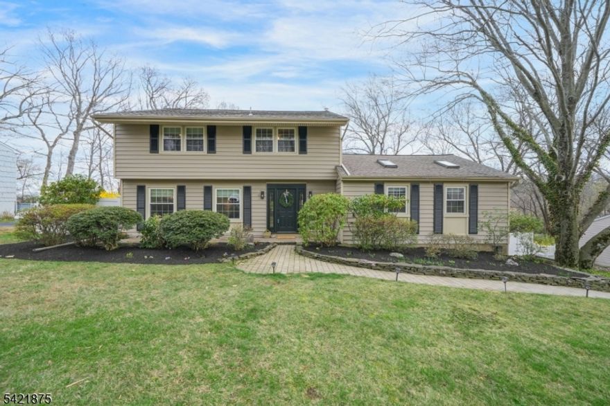 Move right into this beautifully renovated home in sought-after Morris Township, offering the perfect blend of comfort, style, and exceptional outdoor living. Ideally located less than 2 miles from vibrant downtown Morristown, enjoy easy access to restaurants, shopping, NJ Transit, and top-rated schools, including nearby Hillcrest Elementary while also being just minutes from scenic countryside, local farms, and outdoor recreation.The sun-filled vaulted great room with skylights and a gas fireplace creates a warm, inviting space for everyday living and entertaining. The updated kitchen features stainless steel appliances, granite countertops, and abundant cabinetry, flowing seamlessly into the dining room and out to an expansive deck perfect for indoor-outdoor living.Step outside to a private backyard retreat featuring multiple decks, a custom gazebo, and an in-ground pool, offering endless opportunities for relaxing, entertaining, and enjoying the natural setting.Upstairs offers 4 spacious bedrooms, including a primary suite with updated bath, plus a beautifully renovated hall bath. Hardwood floors run throughout, and a finished lower level provides flexible space for recreation, work, or play.Additional highlights include generator hookup and meticulous maintenance throughout.A rare opportunity to enjoy the best of both worlds convenience and countryside in one of Morris Township's most desirable locations.