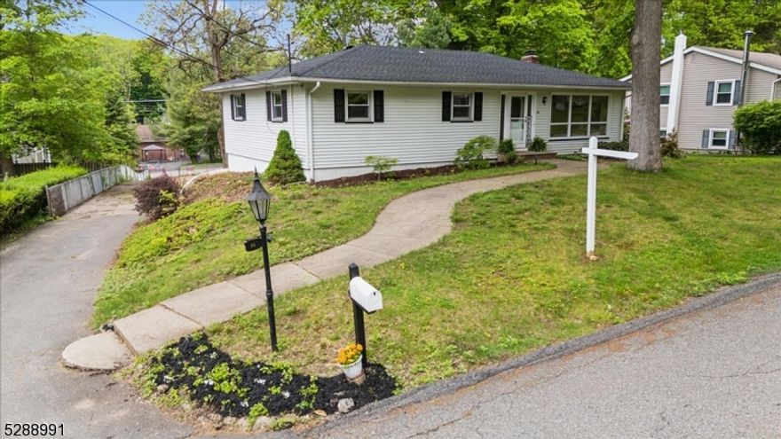 Welcome to the lake! Move right into this bright & sunny renovated ranch with a fully finished walkout basement and massive backyard in Prospect Point, Lake Hopatcong. This ranch home truly has it all! NEW Septic, NEW central AC, NEW roof, recessed lighting, ceiling fans & curb appeal on a dead-end street. The main floor has a sun-filled living room with large floor-to-ceiling windows, an updated kitchen, dedicated dining room with sliders to a large back deck, completely one-floor living with 3 bedrooms and 1 full bath. The finished basement adds even more living space with a spacious family room, den/study area, another full bath, laundry room, bar, fireplace & sliders to the back patio!  Completing this floor is a huge oversized 2-car garage, it's the full depth of the house so it's perfect for a workshop + 2 cars. This home also has a large fenced yard with a long driveway that extends to N New York Ave, and ample off-street parking (a rare find in the lake community). Easy access to Route 15, close to multiple stores, restaurants including 8 waterfront, shopping, train to NYC, Route 80, top-rated schools & marinas, allowing you to dock a boat. Enjoy all the conveniences of urban living in a lake-like setting year-round at New Jersey's largest freshwater lake offering residents & visitors outstanding boating, sailing, kayaking, swimming, fishing, water sports & more! Bonus, you can join the Capp Beach Club for even more summer enjoyment!