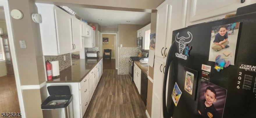 This Belleville home features a Charming and spacious side hall colonial with original chestnut trim.spacious living room ,dining room and eat in kitchen. with a sitting room off the living room. It has 3 bedrooms on the 2nd floor and bonus large bedroom with  walk up stairs from the 2nd floor to a large finished attic. Also convenient to schools , shopping, highways and public transportation.