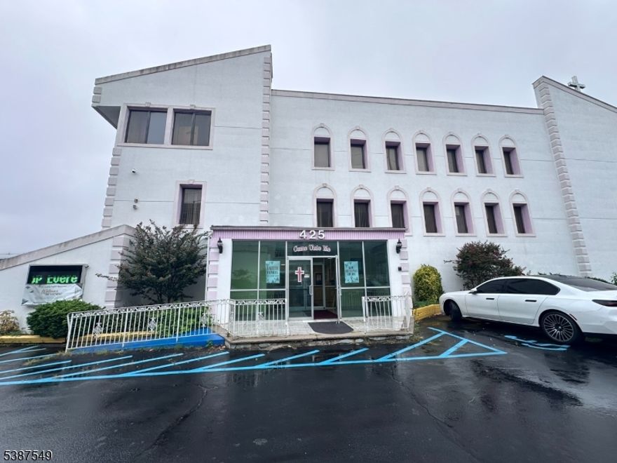 Modern style building zoned for special purposes on over half an acre. Features 80 parking spaces in fenced in area. Separate office building included in sale. 32 pews accommodating 340. Raised platform for choir and parishioner. Baptismal pool and changing room. Multi levels with offices, kitchen, full sized dining area and passenger elevator. Loading dock.