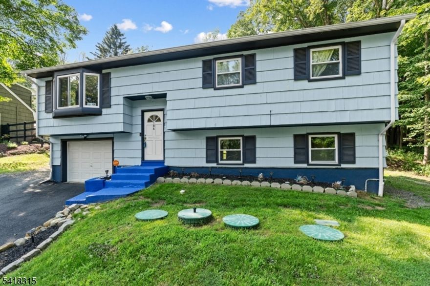 Step into this beautifully updated 4-bedroom, 3-bath bi-level home, where modern upgrades meet comfortable living. completely renovated in 2019, the open floor plan is highlighted by gleaming hardwood floors on the main level and a stylish kitchen with granite countertops, soft-close cabinetry, and stainless steel appliances perfect for cooking and entertaining. Enjoy peace of mind with major system updates, including a new roof, plumbing, central air, septic system, and garage door. Recently converted to natural gas, the home also features a brand-new hot water heater and two sets of sliding glass doors that flood the space with natural light and open to a freshly painted deck ideal for relaxing or hosting gatherings. The lower level offers versatile living with a spacious family room, wet bar, home office, and a fourth bedroom. With three fully updated bathrooms featuring stylish tile flooring, every detail has been thoughtfully designed. Additional highlights include a convenient 1-car garage, modern finishes throughout, and a prime location in a desirable neighborhood. don't miss your chance to see this turnkey gem!