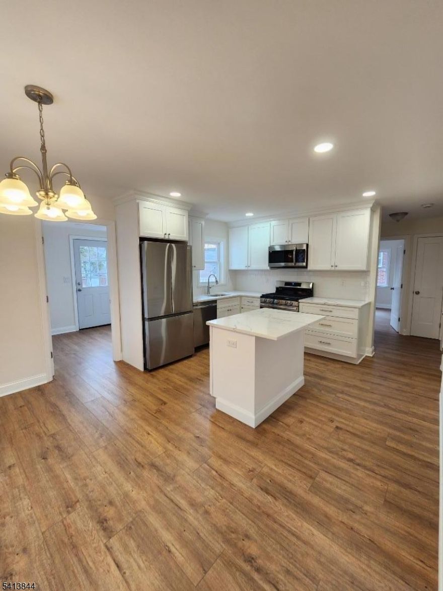 Picture Perfect....Move right in to this fully renovated 4 bedroom 2 bath home. Your dream home is here with brand new kitchen with granite countertop and stainless steel appliances. Lets not forget the center island too.. with plenty of room for a Dining room table to fit as well. The entire house has been freshly painted and LVP flooring throughout with neutral colors to fit anyone's decor. You will fall in love with 2 brand new bathrooms with marble tiles and flooring. For no maintenance concerns you have new siding, roof, HWH, furnace and central air. Just move right in to your dream home today. Easy access to NYC ferry, trains and Hwys. For a relaxing day visit your waterfront 3 minutes away.