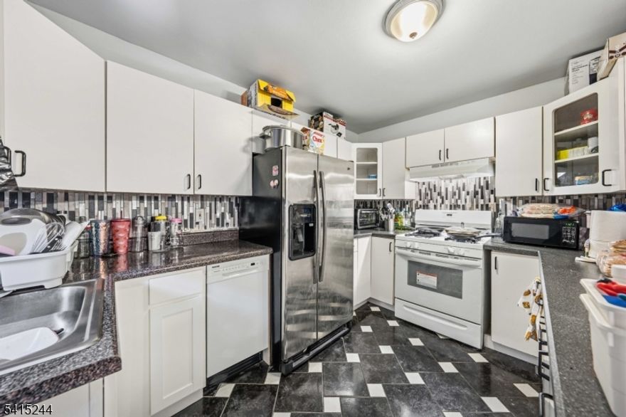 Bright 2-bedroom, 2-bathroom condo in a prime central location. Features include an open-concept layout with hardwood floors and a private balcony for outdoor enjoyment. The primary suite offers a private retreat with an en-suite bath and an impressive walk-in closet. Unbeatable location within walking distance to schools, shopping, dining, and the train station. Perfect for commuters and urban dwellers alike! Move in with confidence: Seller will pre-pay your first 12 months of HOA fees via a $10,000 closing credit. Enjoy a full year of maintenance-free living without the monthly overhead, allowing you to settle in and save while your home value grows.