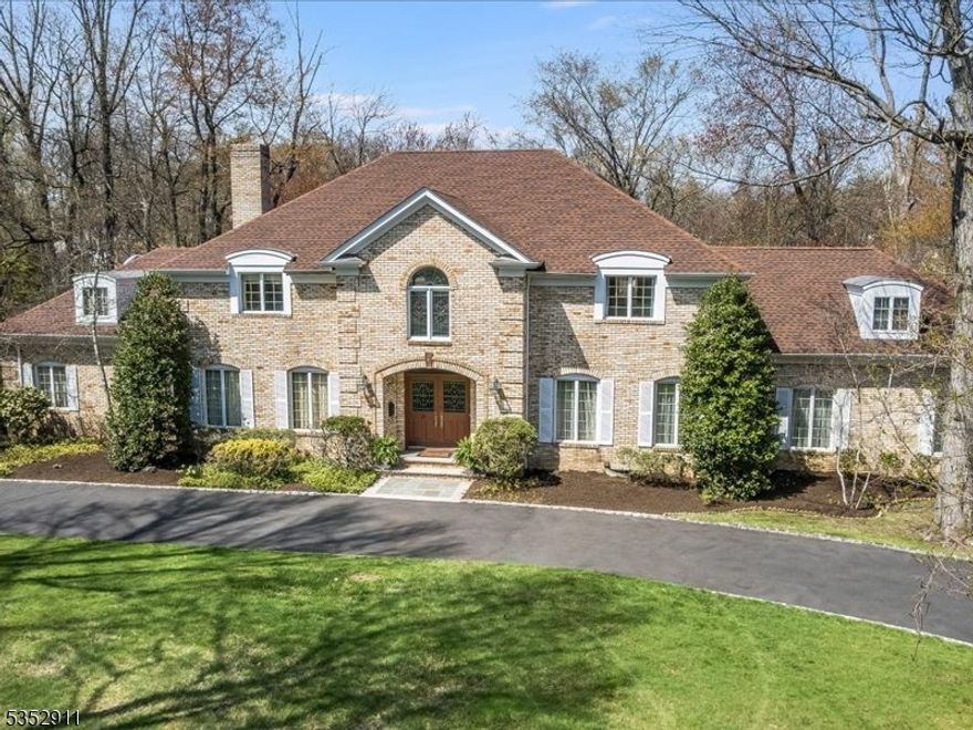 Custom-built original owner home in sought-after Essex Fells, one of northern NJ's most desired communities.  Set on an acre in a prime location, the home boasts plenty of curb appeal with its sweeping front lawn, circular driveway and stately double-door entrance. Elegant formal rooms and comfortable living spaces, floor to ceiling windows, French doors, high ceilings and exceptional millwork are all key elements of the interior. Highlights include a double-height Foyer with beautiful turned staircase and leaded glass Palladian window, banquet-sized Dining Room, formal Living Room, vast Family Room with large stone fireplace, cozy Den with fireplace. Large eat-in Kitchen has a casual dining area with lovely panoramic views of the town Skating Pond. Tranquil Primary Suite with en-suite Bath, two walk-in closets and Sitting Room. Three additional Bedrooms and full Bath complete the second level. Fabulous lower level Recreation Room with huge circular wet bar, fireplace and second Kitchen. Essex Fells is a peaceful oasis known for its extraordinary natural beauty and excellent schools - only 23 miles from NYC.