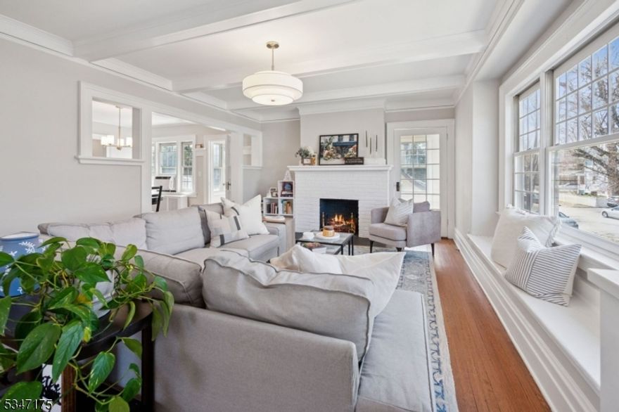 Welcome to this bright and airy 2 bedroom, 1 bath unit perfectly designed for easy living. As you step inside, you'll be greeted by an abundance of natural light, creating a warm and inviting atmosphere that makes this home truly special. Walk into the open living room with an office nook, dining room then the beautifully renovated kitchen that is a cook's delight. Continue to the oversized primary bedroom, full bathroom and the comfortable second bedroom. And there is a bonus sun room that can used as an office or family room. Elegant hardwood floors throughout the large apartment. Separate laundry in the basement with additional storage space. Great dedicated patio for this unit in the deep, parklike lot. Fantastic in-town location, close to Downtown Montclair, Walnut Street train station, Watchung Plaza and Edgemont Park. It doesn't get much better than this! NTN Report and application required. No Pets please