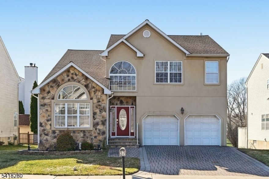 Stunning east-facing home nestled in one of Bridgewater's most sought-after neighborhoods, located within a top-tier school district. Freshly painted, grand two-story foyer welcomes you in, setting the tone for the spacious and light-filled interior, enhanced by elegant 9-ft ceilings on the main level that create an open and airy ambiance. Featuring 4 generously sized bedrooms and 2.5 baths, along with a fully finished walkout basement, this home provides versatile living space ideal for entertaining, working from home, or relaxing. The upgraded kitchen, with appliances updated within the last 7 years, is thoughtfully designed with built-in spice racks and convenient lazy Susan cabinets in both corners, maximizing storage and functionality. It seamlessly connects to the main living areas, all enhanced by abundant natural sunlight. The finished walkout basement offers incredible flexibility and includes plumbing already in place for a future bathroom, providing an excellent opportunity to further customize the space to your needs. Step outside to your expansive 400 sq ft Trex deck perfect for hosting gatherings, enjoying your morning coffee, or unwinding in your private outdoor retreat. Additional highlights include a two-car garage and a beautifully paved driveway. Major updates include a newer roof (6 years old) and a 2-zone HVAC system (just 4 years old). This is more than just a home it's a lifestyle. Don't miss this exceptional opportunity!