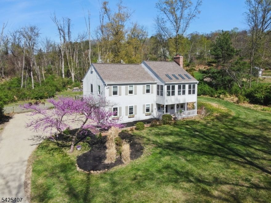 Nestled in scenic Long Valley with a Califon address, this modern farmhouse offers an open layout filled with abundant natural light, three bedrooms plus an office and playroom/gym. The beautiful eat-in kitchen is ideal for everyday living and entertaining. A private, oversized third-floor room with skylights provides the perfect retreat, while the ground floor features a possible in-law suite with a separate entrance, kitchenette, and bath. Step onto multiple-level decks, including a great entertaining deck, all with captivating mountain views. Set on a private 1.8-acre lot, this home offers a true park-like setting. Includes a generator hookup for added peace of mind, and second-floor bedroom furniture can be included if desired. Convenient to hiking and biking paths, restaurants, and highways. Brand new primary bathroom! Great views!