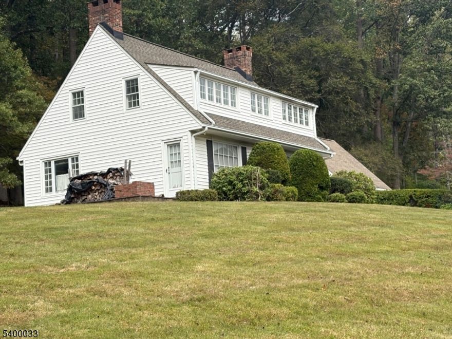 SOLD BEFORE DISTRIBUTION. FOR COMP PURPOSES ONLY. Location, location, location. This lovely colonial style home is situated on almost 2 acres of serene, lush and spacious property. Century Lane is an extremely desirable private road, in one of the best neighborhood areas in Watchung! This home is surrounded by multi million dollar mansion-like homes that have all been recently renovated or rebuilt. New above ground oil tank! Underground oil tank recently removed w/No Further Action letter in place. Property includes public sewer, gas line on property, allowing for connection to public gas if so desired. There is also public water connection located where the property meets the street! Other recent improvements include: sump pump ( 2 1/2 years old). front half of roof replaced approximately 5 years ago, back half of roof replaced around 1996/1997, eat-in kitchen renovated sometime in the mid 1990's with oak cabinets and pantry and Kitchen Aid stainless steel dishwasher (2025).2 car garage with loft area for plenty of storage. Hardwood floors throughout the home. Wood burning fireplace in living room makes for cozy environment on those cold, wintry days. Breezeway is a great flexible living space, including enclosed porch! 4th bedroom on first floor currently utilized as a den. This home has so much potential with a great floor plan with lots of sunlit rooms!