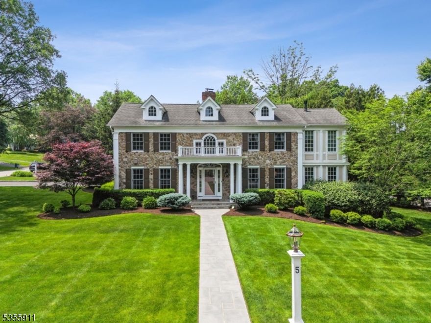Stunning 5BR, 4.1BA stone-front Center Hall Colonial, thoughtfully renovated and beautifully maintained. A soaring 2-story foyer welcomes you into elegant formal rooms and sunlit living spaces, enhanced by rich hardwood floors, custom millwork, and timeless architectural detail. The chef's kitchen features high-end appliances including Sub-Zero and Viking, and opens to a spacious family room with coffered ceiling and fireplace. Work-from-home ready with a handsome first-floor office. Enjoy the warmth of 3 fireplaces, a front and back staircase, and a luxurious primary suite with spa-like bath. The finished lower level, raised bluestone patio, and 2-car garage complete this exceptional offering. Truly turnkey don't miss this decorator's dream home!