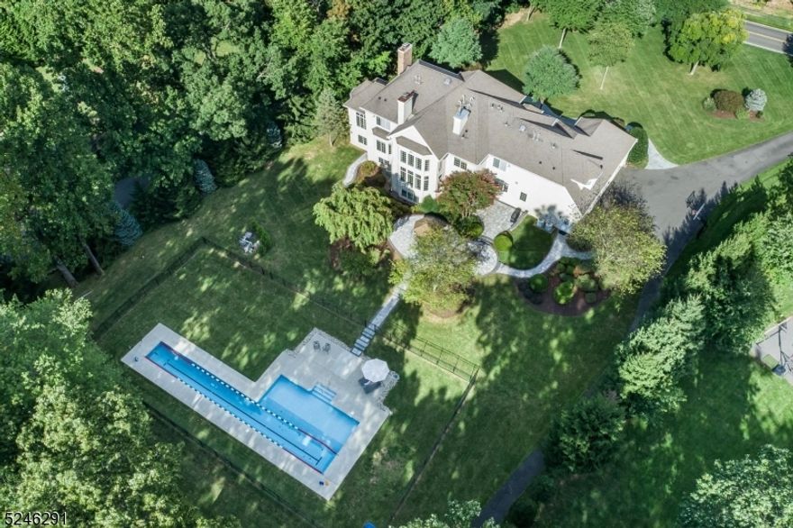 209 King George Road is an exquisite custom brick colonial situated on 3 acres in highly sought after Warren Township. Its 3 beautifully designed levels offer 7 bedrooms, 6.2 baths, a 4 car garage, a 1st floor guest suite, a home office, a finished walkout lower level, 2 laundry rooms and a beautiful heated inground pool.  The total living area is more than 7800 sq ft, not counting additional copious storage. The home backs up to several acres of woods and is straddled on either side by mature evergreens, thus offering substantial year-round privacy and natural beauty.The heart of the home is a chef's dream kitchen, a culinary sanctuary with top-of-the-line appliances, beautiful cabinetry, and stone countertops. This effortlessly transitions into a large, light-drenched family room with fantastic views of the surrounding landscape. The master suite is a large, light-filled private retreat, complete with a spa-like bathroom and separate large his-and-hers walk-in closets.  The finished walkout lower level is large and filled with natural light, and offers a bedroom suite with full bath its own entrance, an open recreation area, a media area, a fitness room, a craft room, an additional half bath.  The lavish and large patio and pool offer access to the yard's great natural beauty. This unique pool is heated, can be bubbled for year-round use. The home is also supported by two whole-house backup generators.