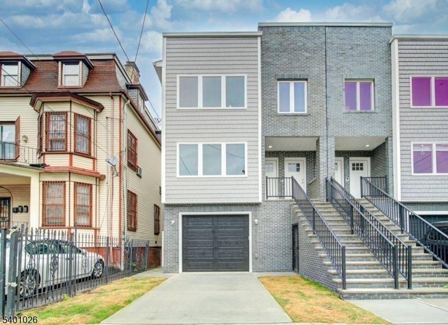 Brand-new 3-bedroom, 2-bath first-floor unit in a modern 2-story duplex located in Newark. Open-concept layout with hardwood floors throughout, contemporary eat-in kitchen with breakfast bar and stainless steel appliances, and in-unit laundry. Features central air conditioning, forced hot air heating, excellent natural light, and generously sized bedrooms, including a primary bedroom with walk-in closet. Conveniently located near Bloomfield Avenue with easy access to public transportation, major highways, shopping, restaurants, and schools. Tenant responsible for utilities. No smoking. Pets subject to landlord approval.