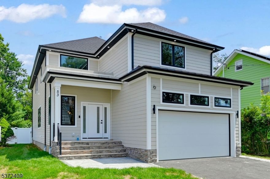 Stunning NEW CONSTRUCTION COLONIAL home offering approx 4,400 sqft of luxurious living space across 3 floors with FENCED Backyard. This 6 bedroom, 5 bathroom residence is a true gem. As you enter through the covered entry porch, you are greeted by a Two-Story Foyer that sets the tone for the open and airy layout. The home features a large kitchen equipped with custom cabinetry, high-end stainless steel appliances, walk-in pantry and luxurious quartz countertops. The large island is perfect for casual dining and entertaining. The kitchen seamlessly flows into the Living/ family room, which boasts a cozy fireplace & sliding doors lead out to the expansive Flat backyard, ideal for enjoying the outdoors. The first floor also includes an ensuite bedroom, perfect for guests or as a private office space. Upstairs, you'll find four additional bedrooms and a dedicated laundry area. The primary suite is a true retreat, featuring a PRIVATE BALCONY, two walk-in closets and a spa-like bathroom complete with a stall shower, soaking tub, and double vanity. Three additional bedrooms, one with an en-suite bath. The fully finished basement adds even more versatility to this home, featuring an additional bedroom, full bathroom, a generous recreation room, perfect for entertaining. Ideally situated just steps from public transportation to NYC, and within walking distance to the town pool and fields. 10-Year Builder Warranty