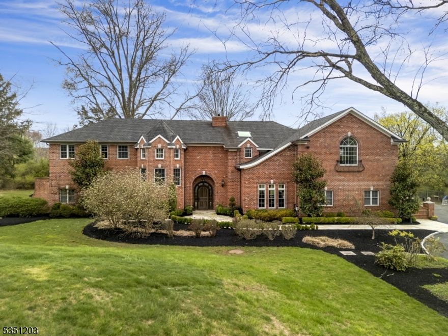 Prepare to FALL IN LOVE with this one-of-a-kind Custom brick home on 3 level Acres, with low taxes, blue ribbon schools & beautifully designed with architectural features of a castle. From the moment you step into the elegant foyer, you'll be captivated by the sophistication that flows throughout the home. The expansive great room is a true showpiece, with walls of windows that bathe the space in natural light. Finishes include custom tray ceilings, handcrafted wood floors, a stunning solid wood front door, and exquisite moldings. The modern kitchen is complete with SS appliances, wine fridge, pantry, generous counter space & breakfast bar. The main floor also features a comfortable bedroom with full bath, a stylish powder room, den, and the open-concept kitchen, DR & LR. Sitting Area at stair landing. Upstairs, you'll find three spacious bedrooms, three full baths, laundry room & an open loft family room  could easily be a 5th bedroom. Loft area access with sliders to a massive deck overlooking the yard. The primary suite is a retreat, offering a sitting area, ample closet space, and a beautifully appointed bath with soaking tub and stall shower. Brand New Driveway. Step outside into a private oasis designed for relaxation & enjoyment, featuring multiple patios, lush greenery, & a built-in fire pit. A fully finished  500 Sq Ft  barn-style outbuilding with heating adds incredible versatility perfect as a home office, studio, or entertainment space.