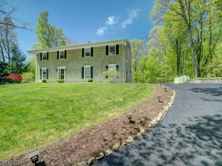 Privacy Galore & Move in Ready!  This beauty has 4 Bedrooms, 2.5 baths and is nestled on over a one acre wooded lot. NEWER FURNACE INSTALLED 2022.  Bathrooms have been beautifully renovated & kitchen has been updated. First floor features large foyer, bedroom presently being used as home office, large family room/den with electric fireplace & sliders that lead to patio/yard, half bath/laundry, large closet and access to garage. Main level features wood floors, updated kitchen and spacious living and dining rooms, main bath & 3 bedrooms. Primary bedroom has its own bath.  Enjoy the beautiful yard and privacy from the deck off dining room.  Close to major highways, public transportation and shopping. Hurry --will not last!