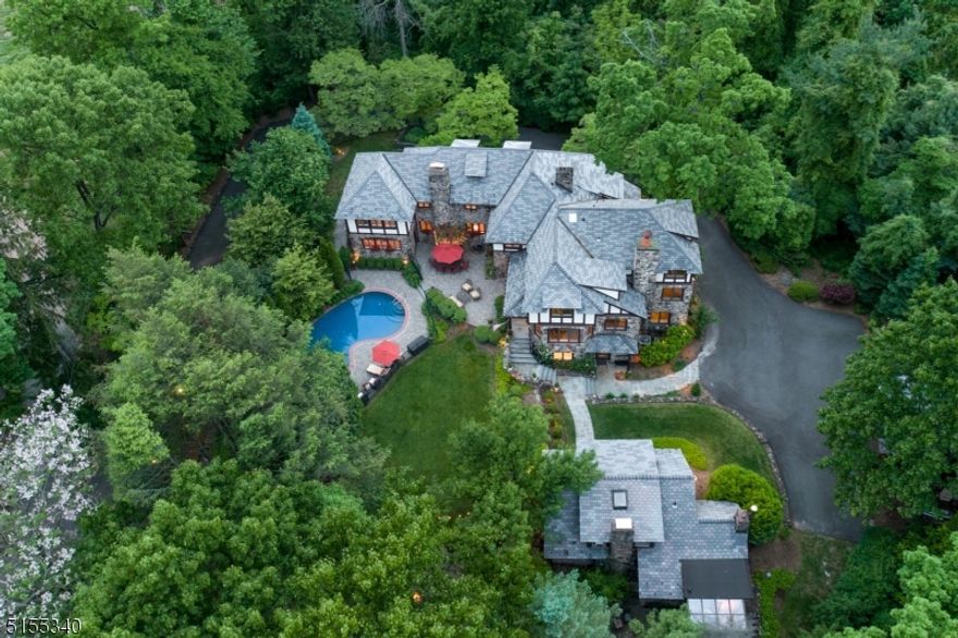 Don't miss this rare opportunity home that transports you to your own private oasis! Lovingly maintained, richly landscaped soother of a home with a fabulous floorplan, outdoor entertaining spaces, carriage house, and ultra-private backyard (2.48 acres). Gracious Entry Foyer. Formal Living Room with bountiful sunlight and a stately fireplace. Original Family Room with walls of windows overlooking the property. Formal Dining Room with oversized windows, glass double doors, and fireplace. Second Family Room with fireplace, exposed wood beam ceiling, brick accent wall, and wet bar. Gourmet Eat-In Kitchen with top-of-the-line stainless steel appliances, cheery breakfast area, walk-in pantry, and access to the backyard. Serene Primary Suite with two-level walk-in closet, ample storage, newly updated bath, and private bedroom with views of the property. Expansive lower level with Recreation Room, Laundry, Full bath, Sauna, and endless storage. Expansive property with multiple patios, meticulous landscaping, and a fenced-in pool. Charming two-level, one-bedroom carriage house with living room, kitchen, sunroom, and dining room. Close to downtown Westfield, fantastic shopping and restaurants, NYC Train, and top-notch schools, this home has it all!