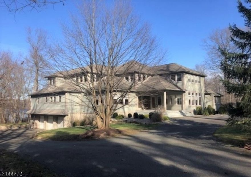 Lakeside home in prestigious, gated lake community only 35 miles from Manhattan. Warm, sophisticated, Contemporary being sold for the first time by its only owner. This home is an entertainer's, nature lover's, and art collector's dream yet perfect for comfortable living and benefited by a strong local school system. It is commutable to the city and yet, also the perfect country, weekend or vacation residence for those looking to spend part-time or full-time out of New York. Its location near the very end of a long cul-de-sac makes for little traffic, greater calm and better morning runs and evening strolls. The house is well landscaped with an inground swimming pool and integrated with its surroundings to create a very private world. Smoke Rise offers a distinctive life style in a 2,500 acre premier, private residential club community with 24 hour security gates, a 120 acre lake, numerous social and sporting amenities and the elegant Village Inn.